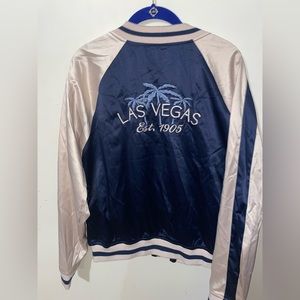 Pink and navy blue jacket. Bought from a Vegas boutique.